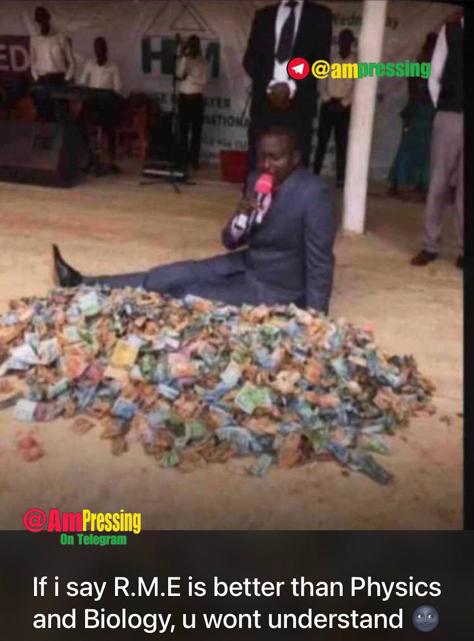 a man sitting on the ground with money